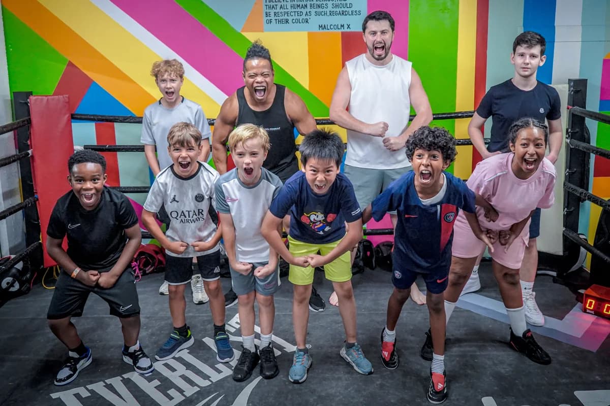 Young participants and adults together in the ring
